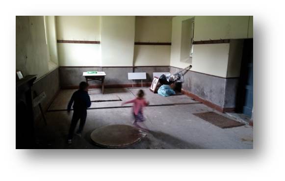 Inside the Temperance Hall with the kids running riot