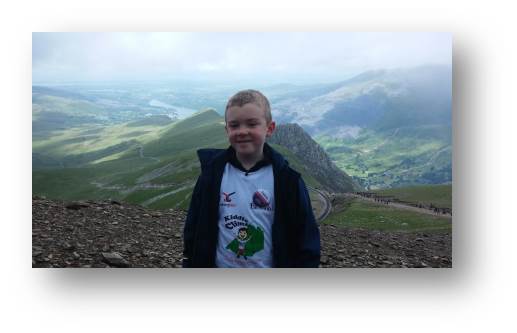 A photo of a super proud Adam at the top of Mount Snowden taken by a super-proud dad at the other side of the camera.