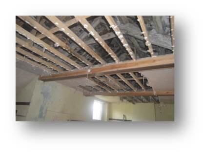 A photo of the knackered ceiling at Temperance Hall once the plasterboard became too swollen to stay on I gave it a bit of encouragement and could take a proper look at the beams holding the place up.
