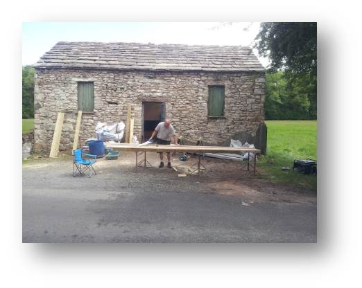 My father in law Gary getting busy cutting the 6x3 rafters for the rear roof