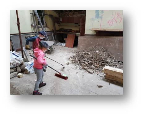 The kids getting stuck into the big clean up