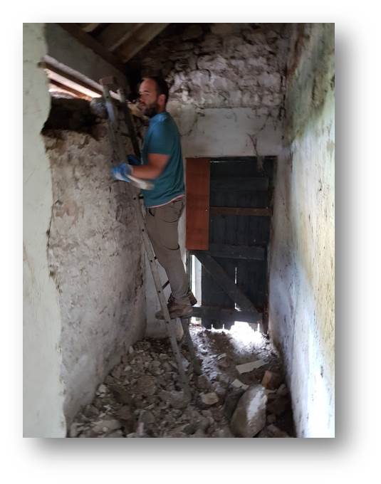 Breaking down the rear wall is possible because of the new lintel we installed to support the roof structure