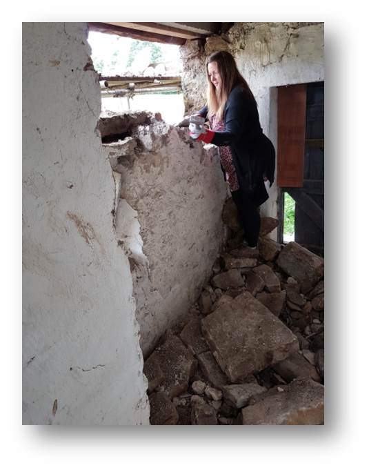 Rachel getting stuck into some demolition