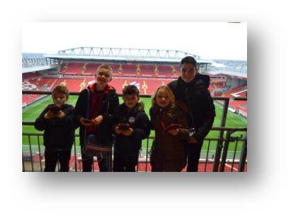 Some of the grandkids posing in front of the Anfield pitch. Felix, who was only a baby at the time stayed at home.