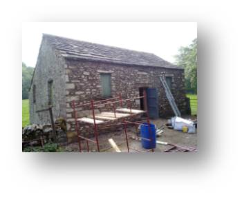 It's a race to get the mortar on the walls fast before the sun comes over to the west facing front wall.