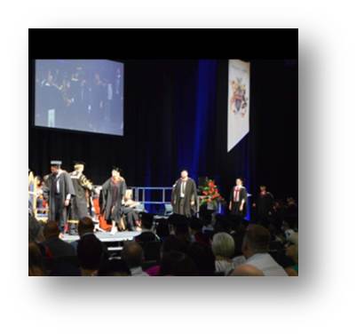 Me nervously accepting my degree from the Derby University faculty in July 2018.