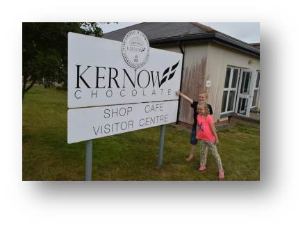 Adam and Emily touring the Kernow nut-free chocolate factory.