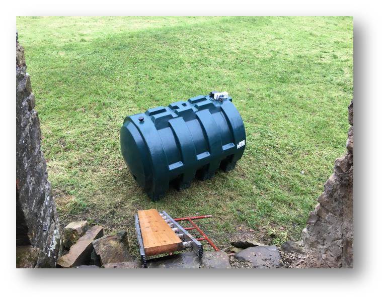 The tank sitting, slowly getting drenched in the field and taunting me from afar