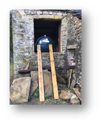 Finally the tank is out of the field and in the building