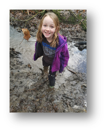 Emily getting stuck in the mud on our woodland walk
