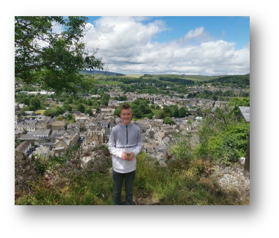 Adam at the top of Castleberg Rock in Settle